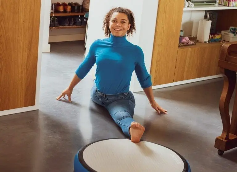 Girl stretching on AirSpot in livingroom