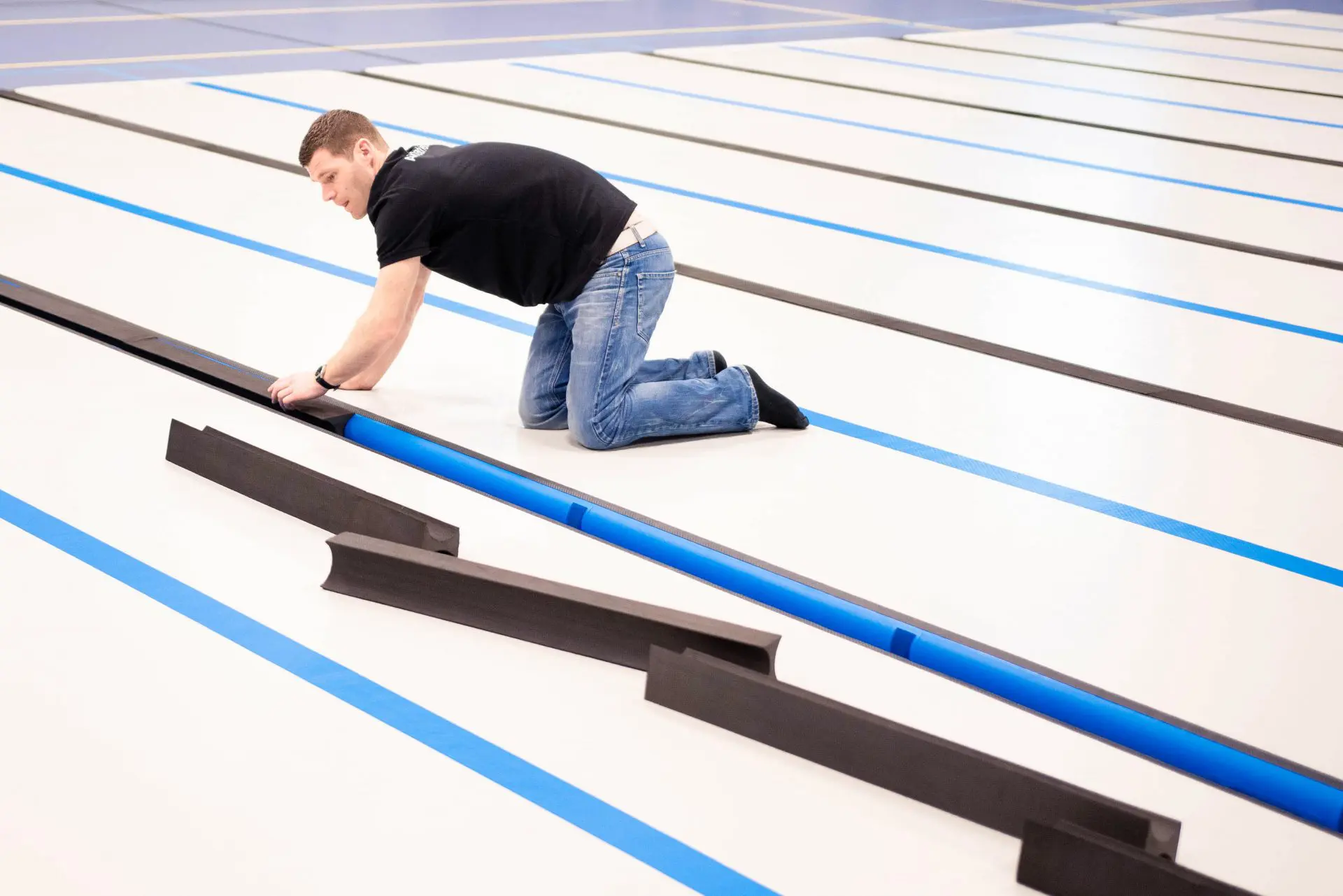 Coach putting in foam connections between AirFloor