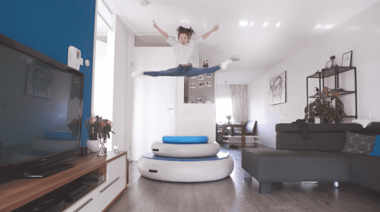 Girl jumping on all AirSpots in livingroom