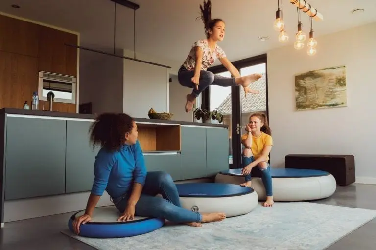 Girl jumping inside on AirSpot with friends