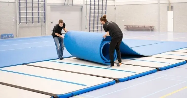 Setting up competition floor gymnastics